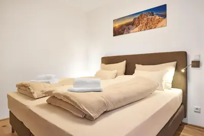 Ein Bett oder Betten in einem Zimmer der Unterkunft Adler Lodge D1 by AA Holiday Homes