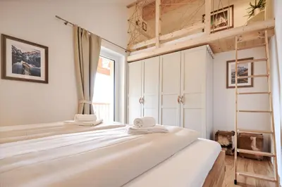 Ein Bett oder Betten in einem Zimmer der Unterkunft die Tauplitz Lodges - Mountain view Lodge A11 by AA Holiday Homes