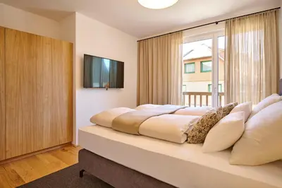 Ein Bett oder Betten in einem Zimmer der Unterkunft die Tauplitz Lodges - Alm Lodge A3 by AA Holiday Homes