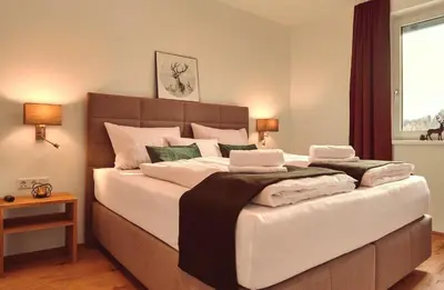 Ein Bett oder Betten in einem Zimmer der Unterkunft die Tauplitz Lodges - Alm Lodge A6 by AA Holiday Homes
