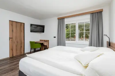 Ein Bett oder Betten in einem Zimmer der Unterkunft Landgasthof Bierfriedl
