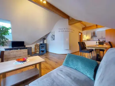 Ein Sitzbereich in der Unterkunft Penthouse Aineckblick