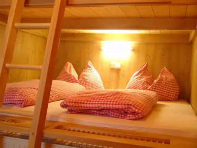 Ein Bett oder Betten in einem Zimmer der Unterkunft Schermerhütten