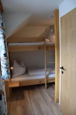 Ein Bett oder Betten in einem Zimmer der Unterkunft Alpenvereinshaus Pruggern