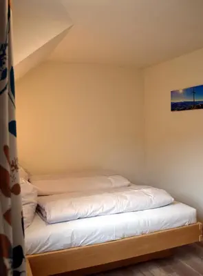 Ein Bett oder Betten in einem Zimmer der Unterkunft Alpenvereinshaus Pruggern