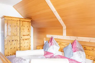 Ein Bett oder Betten in einem Zimmer der Unterkunft Chalet Taurachblick