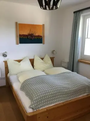 Ein Bett oder Betten in einem Zimmer der Unterkunft Ferienwohnung Neureiter