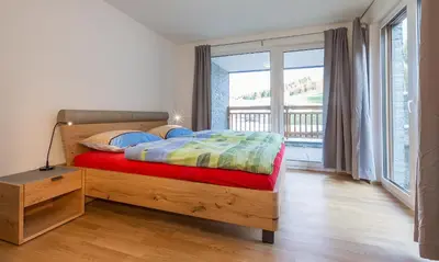Ein Bett oder Betten in einem Zimmer der Unterkunft Ski In Ski Out Apartment Fastenberg Top 2 by AA Holiday Homes