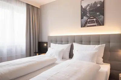 Ein Bett oder Betten in einem Zimmer der Unterkunft Stadthotel Goldenes Schiff