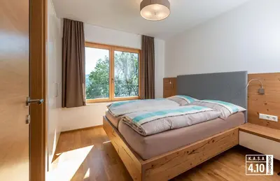 Ein Bett oder Betten in einem Zimmer der Unterkunft KASA 4.10A
