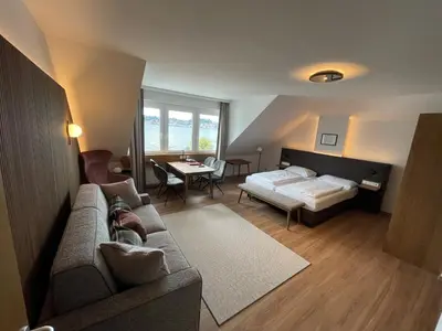 Ein Bett oder Betten in einem Zimmer der Unterkunft Landhotel Grünberg am See