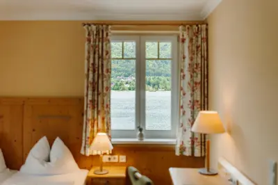 Ein Bett oder Betten in einem Zimmer der Unterkunft Hotel Seerose