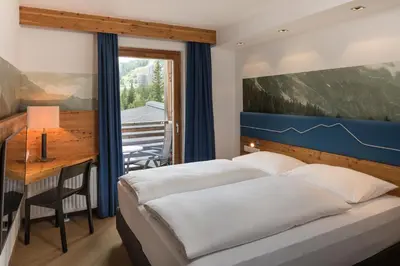 Ein Bett oder Betten in einem Zimmer der Unterkunft Falkensteiner Club Funimation Katschberg