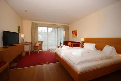 Ein Bett oder Betten in einem Zimmer der Unterkunft Hotel Hollweger