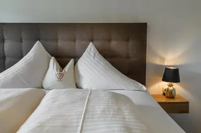 Ein Bett oder Betten in einem Zimmer der Unterkunft Hotel & Restaurant Wastlwirt