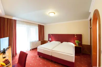 Ein Bett oder Betten in einem Zimmer der Unterkunft Hotel Weinberg GmbH