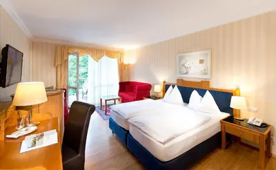 Ein Bett oder Betten in einem Zimmer der Unterkunft EurothermenResort Bad Hall - Hotel Miraverde