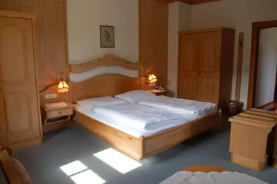 Ein Bett oder Betten in einem Zimmer der Unterkunft Puttererseehof