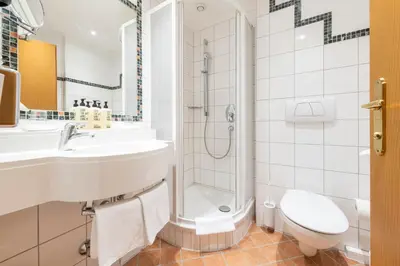 Ein Badezimmer in der Unterkunft Hotel Jakob
