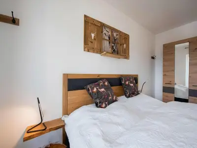 Ein Bett oder Betten in einem Zimmer der Unterkunft Ski-In Area Apartment with Ski Bus