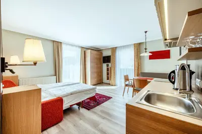 Ein Bett oder Betten in einem Zimmer der Unterkunft Harmls Aparthotel