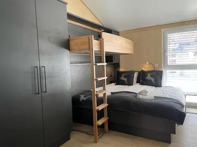 Ein Bett oder Betten in einem Zimmer der Unterkunft Familienhaus Kreischberg