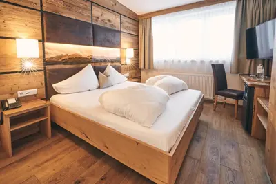 Ein Bett oder Betten in einem Zimmer der Unterkunft Hotel Gamsleiten