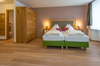 Ein Bett oder Betten in einem Zimmer der Unterkunft Posthotel Radstadt