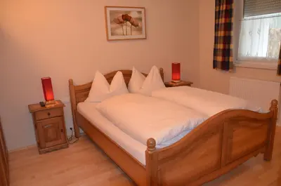 Ein Bett oder Betten in einem Zimmer der Unterkunft Appartement am Schlatterberg
