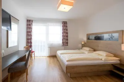 Ein Bett oder Betten in einem Zimmer der Unterkunft Hotel-Restaurant Planaihof