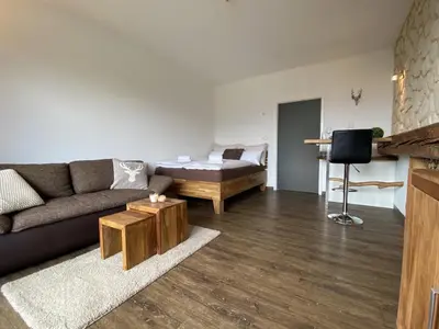 Ein Sitzbereich in der Unterkunft Alpine Studio Apartment by AA Holiday Homes