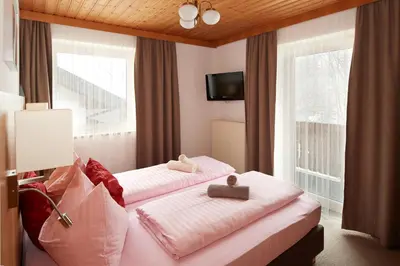 Ein Bett oder Betten in einem Zimmer der Unterkunft Apartments Neue Post