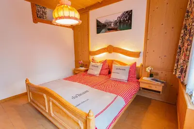 Ein Bett oder Betten in einem Zimmer der Unterkunft Bergidyll 3 by Alpenidyll Apartments