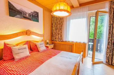 Ein Bett oder Betten in einem Zimmer der Unterkunft Bergidyll 3 by Alpenidyll Apartments