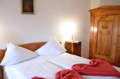 Ein Bett oder Betten in einem Zimmer der Unterkunft Bräugasthof Hallstatt
