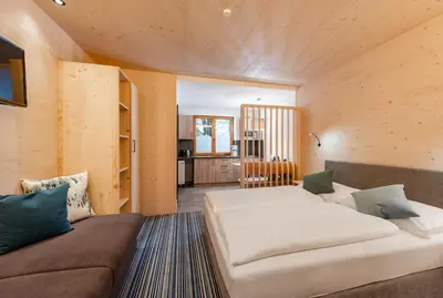 Ein Bett oder Betten in einem Zimmer der Unterkunft Ferienalm Panorama Hotel