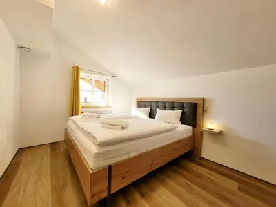 Ein Bett oder Betten in einem Zimmer der Unterkunft Ferienwohnung Flachau Oberlehengut