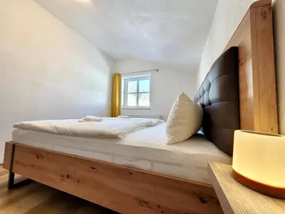 Ein Bett oder Betten in einem Zimmer der Unterkunft Ferienwohnung Flachau Oberlehengut