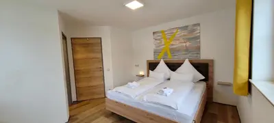 Ein Bett oder Betten in einem Zimmer der Unterkunft Ferienwohnung Flachau Oberlehengut