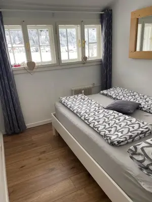 Ein Bett oder Betten in einem Zimmer der Unterkunft Das Almsternderl - gemütliche Wohnung in Gosau