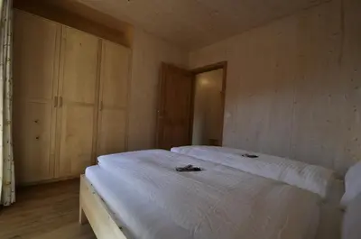 Ein Bett oder Betten in einem Zimmer der Unterkunft Ferienwohnungen Holzidylle