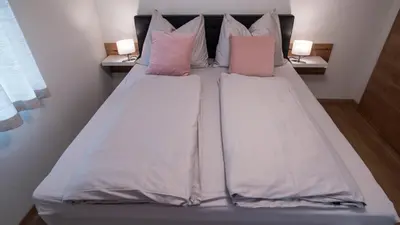 Ein Bett oder Betten in einem Zimmer der Unterkunft DAS JOHANN Apartments im Ausseerland