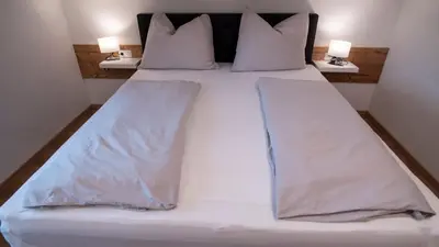Ein Bett oder Betten in einem Zimmer der Unterkunft DAS JOHANN Apartments im Ausseerland