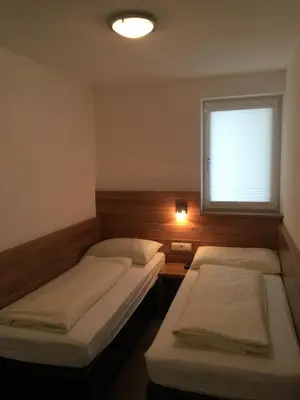 Ein Bett oder Betten in einem Zimmer der Unterkunft TownVille