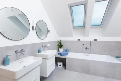 Ein Badezimmer in der Unterkunft HIMMELBLAU - Design Apartment am Mondsee