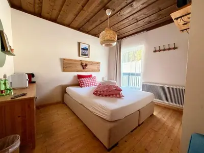 Ein Bett oder Betten in einem Zimmer der Unterkunft Boutique Hotel Alpenhof