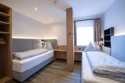 Ein Bett oder Betten in einem Zimmer der Unterkunft Hotel Alpenblick