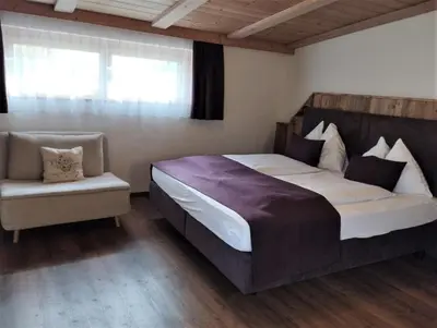 Ein Bett oder Betten in einem Zimmer der Unterkunft Bergidyll 12 by Alpenidyll Apartments