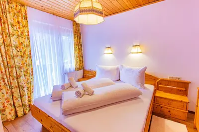 Ein Bett oder Betten in einem Zimmer der Unterkunft Bergidyll 6 by Alpenidyll Apartments