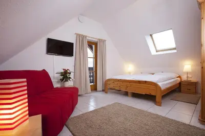 Ein Bett oder Betten in einem Zimmer der Unterkunft Appartementhaus Erasim